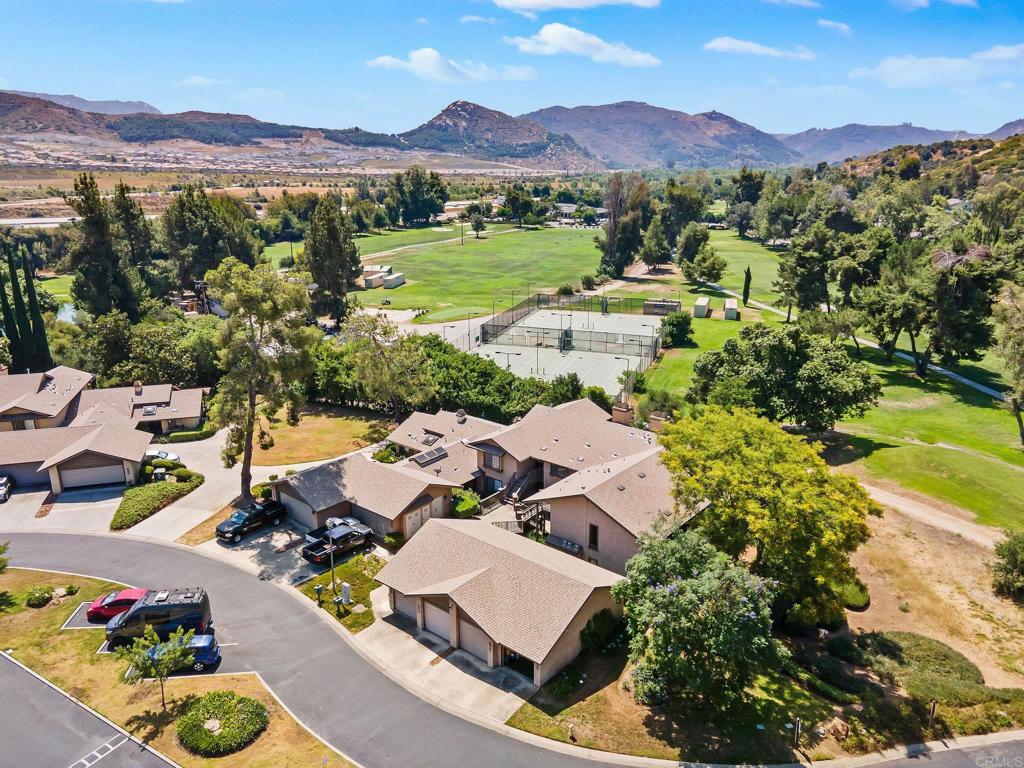 an aerial view of residential houses with outdoor space
