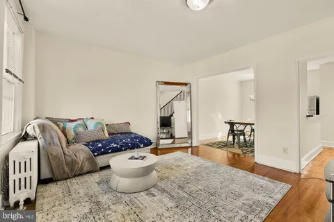 a living room with furniture and a rug