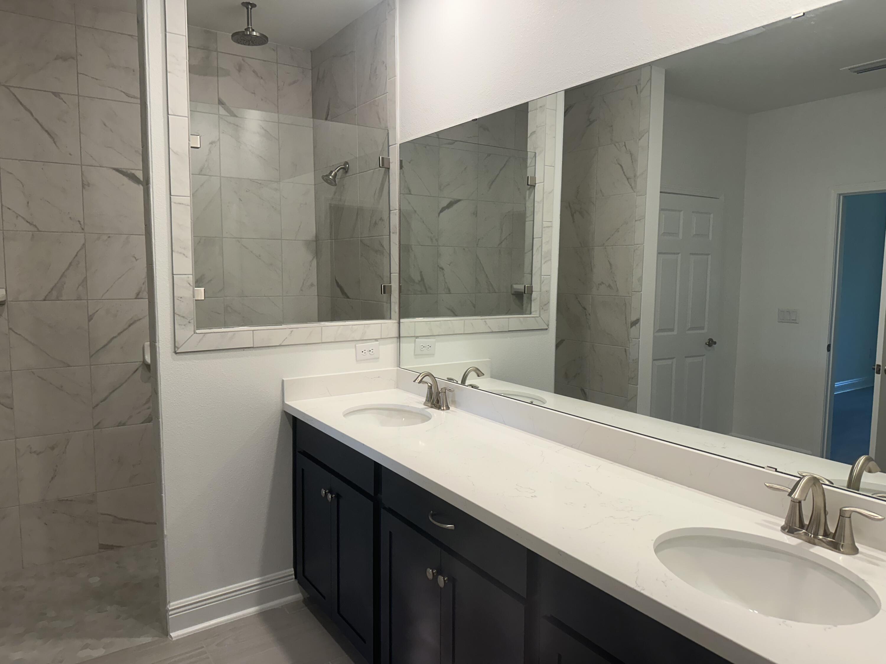 144 Bentgrass Road South Freeport, FL 32439 - Photo 5 of 8 a bathroom with a sink and a mirror
