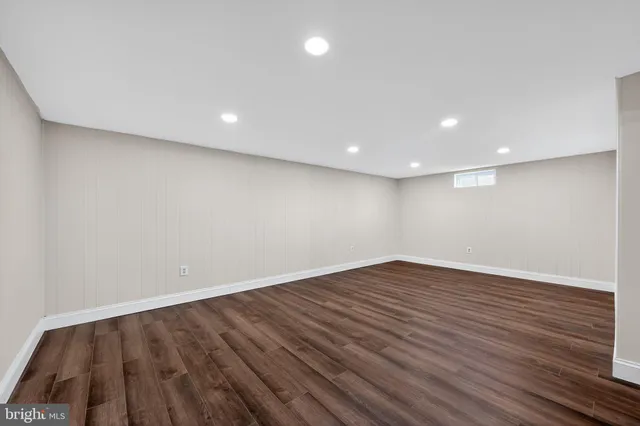 a view of room with wooden floor and window