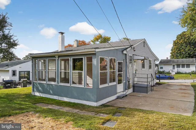 a view of house with outdoor space and swimming pool