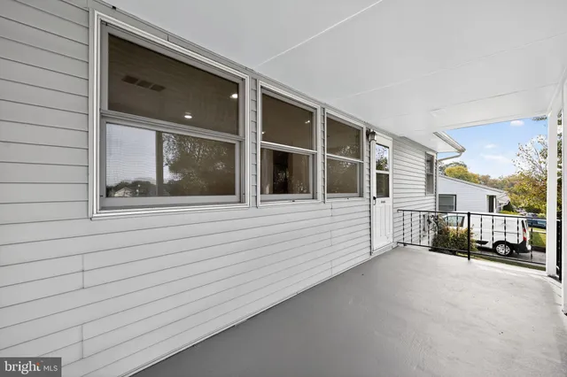 a view of a car park in front of house