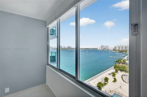 a view of a balcony and floor to ceiling window