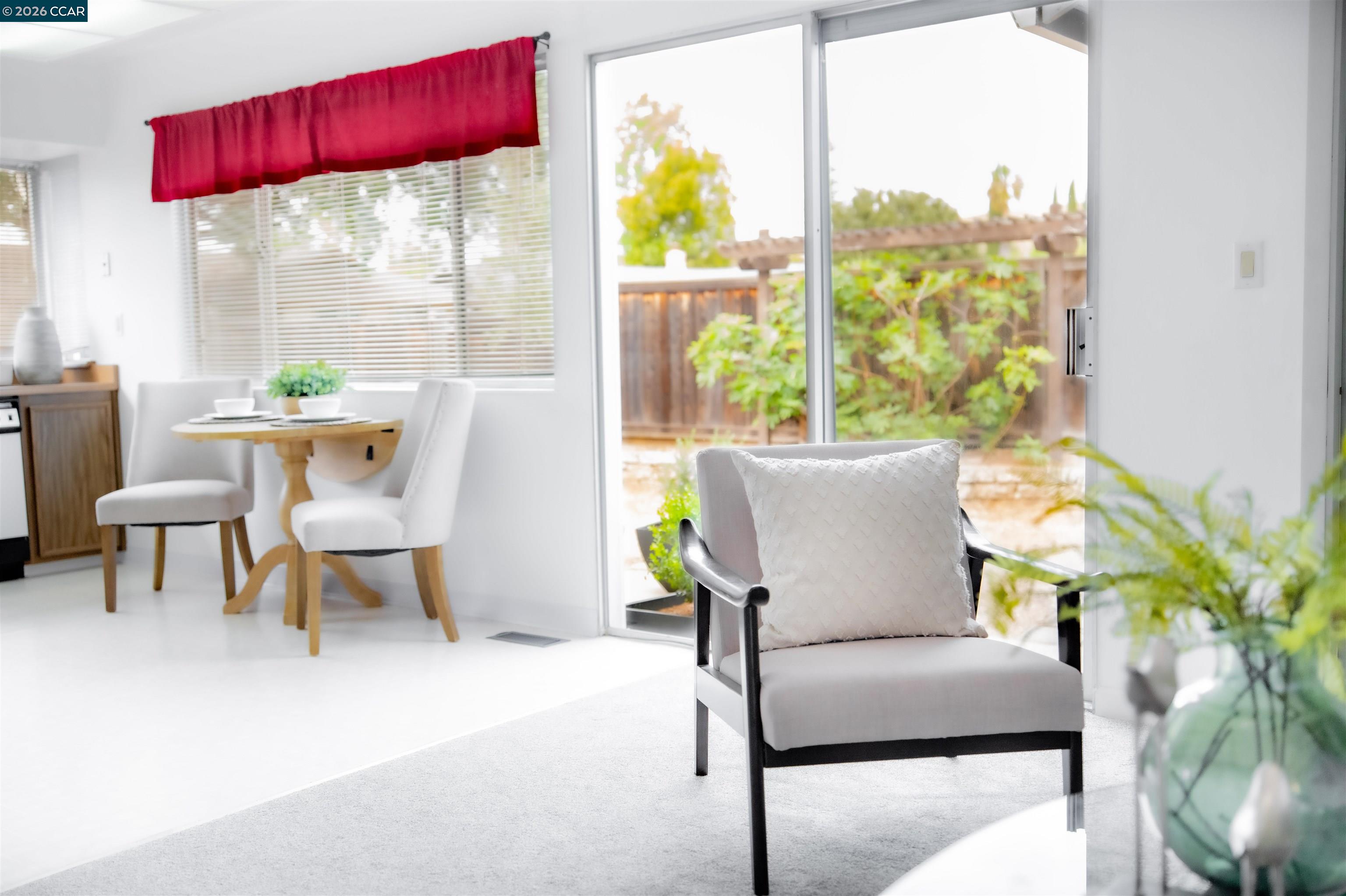 5581 Gonzalez Court Concord, CA 94521 - Photo 15 of 43 a view of a dining room with furniture a potted plant and a table