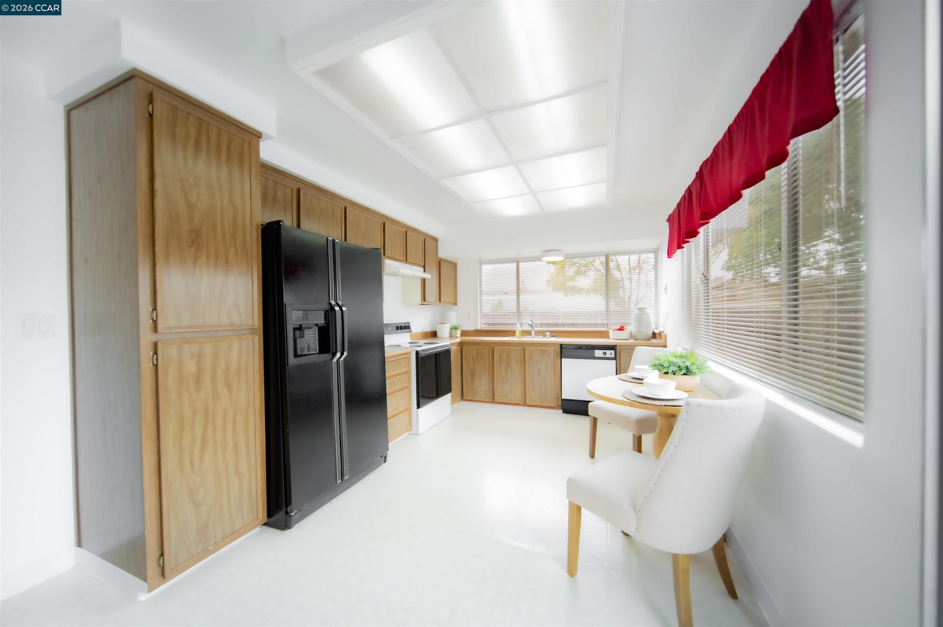 5581 Gonzalez Court Concord, CA 94521 - Photo 16 of 43 a kitchen with white cabinets and stainless steel appliances