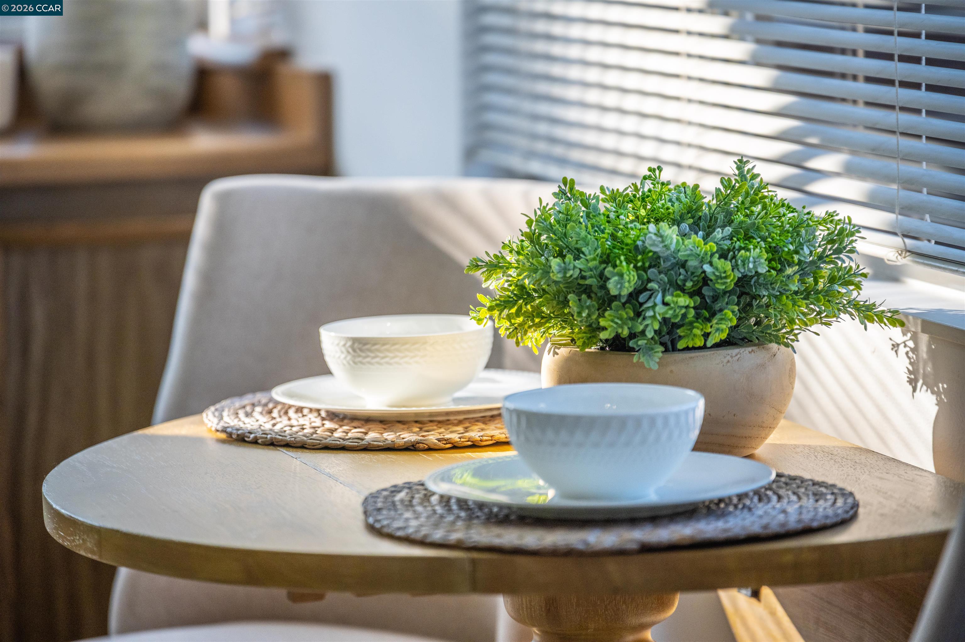 5581 Gonzalez Court Concord, CA 94521 - Photo 17 of 43 a vase of flowers sitting on a dining table