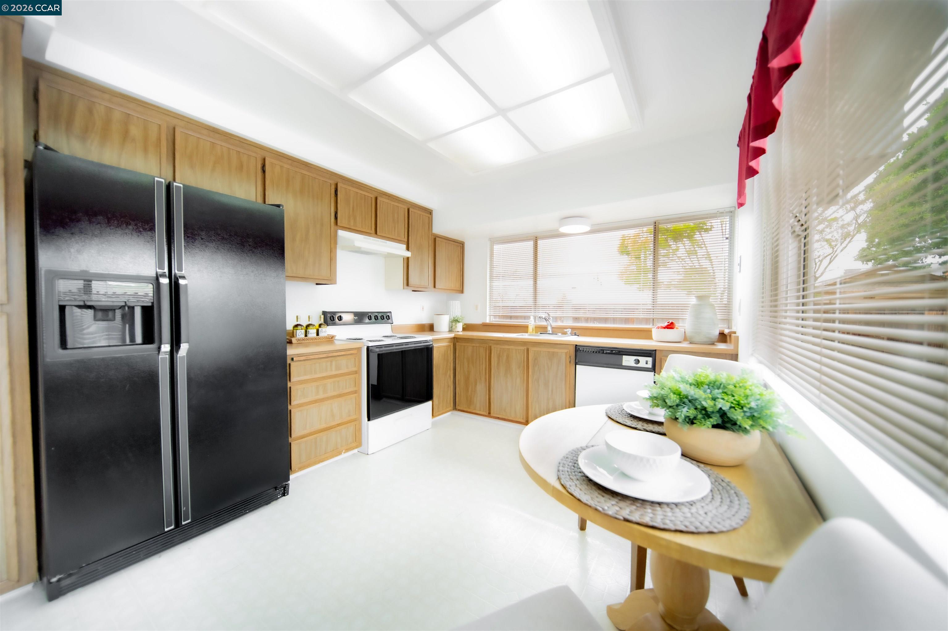 5581 Gonzalez Court Concord, CA 94521 - Photo 18 of 43 a kitchen with stainless steel appliances granite countertop a sink a stove and a refrigerator
