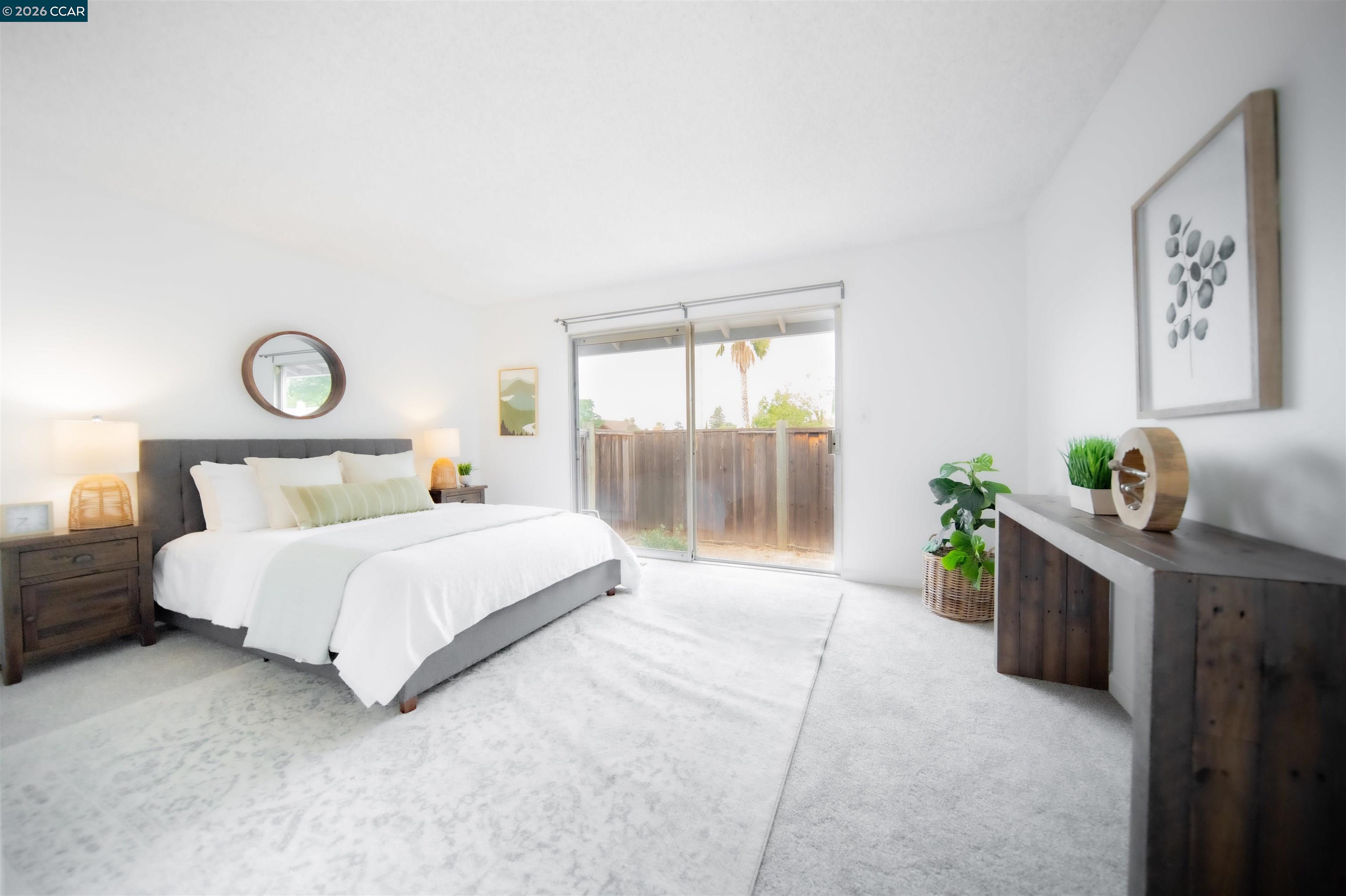 5581 Gonzalez Court Concord, CA 94521 - Photo 24 of 43 a bedroom with a large bed and a potted plant