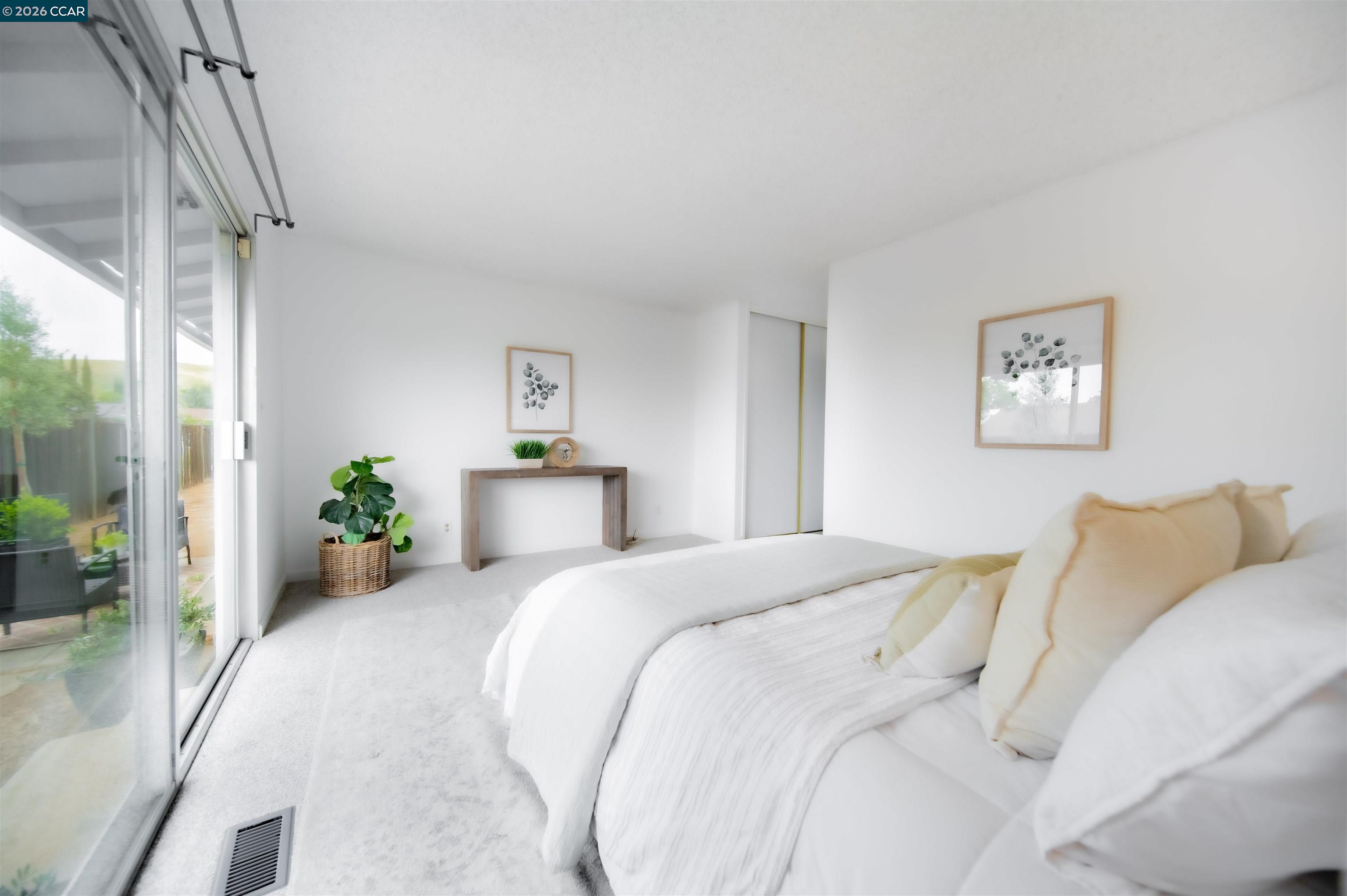 5581 Gonzalez Court Concord, CA 94521 - Photo 28 of 43 a bedroom with a bed and a painting on the wall