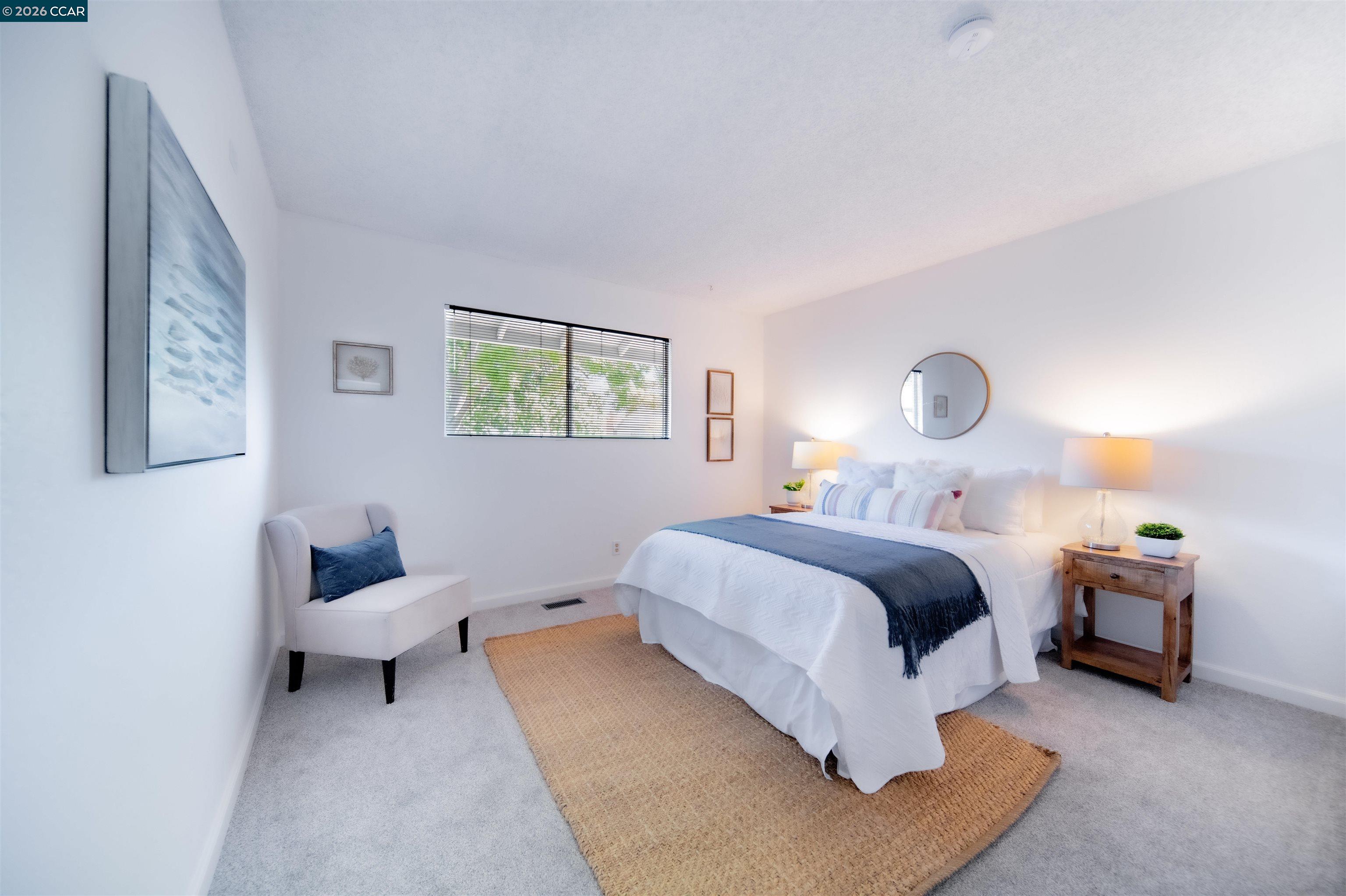 5581 Gonzalez Court Concord, CA 94521 - Photo 32 of 43 a spacious bedroom with a bed and window