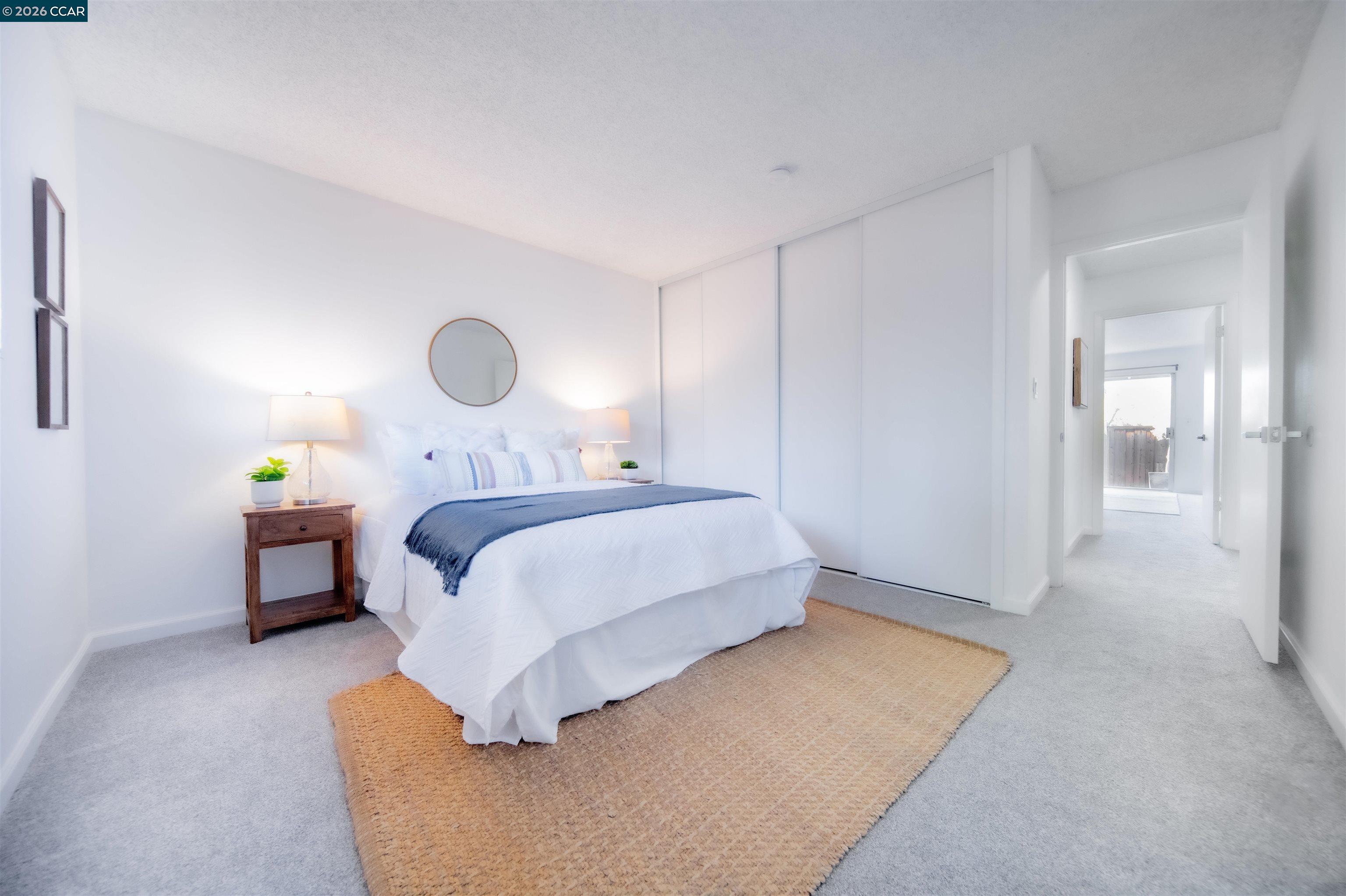 5581 Gonzalez Court Concord, CA 94521 - Photo 33 of 43 a bedroom with a bed and painting on the wall