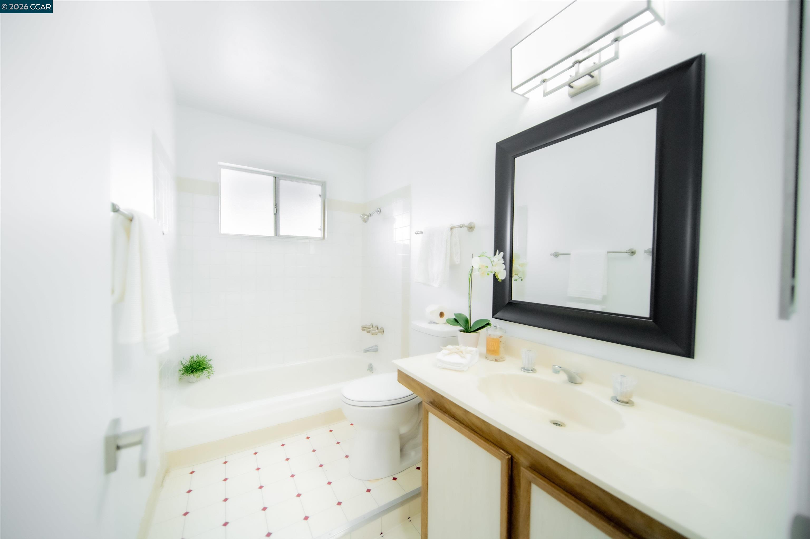 5581 Gonzalez Court Concord, CA 94521 - Photo 34 of 43 a bathroom with a bathtub sink and mirror