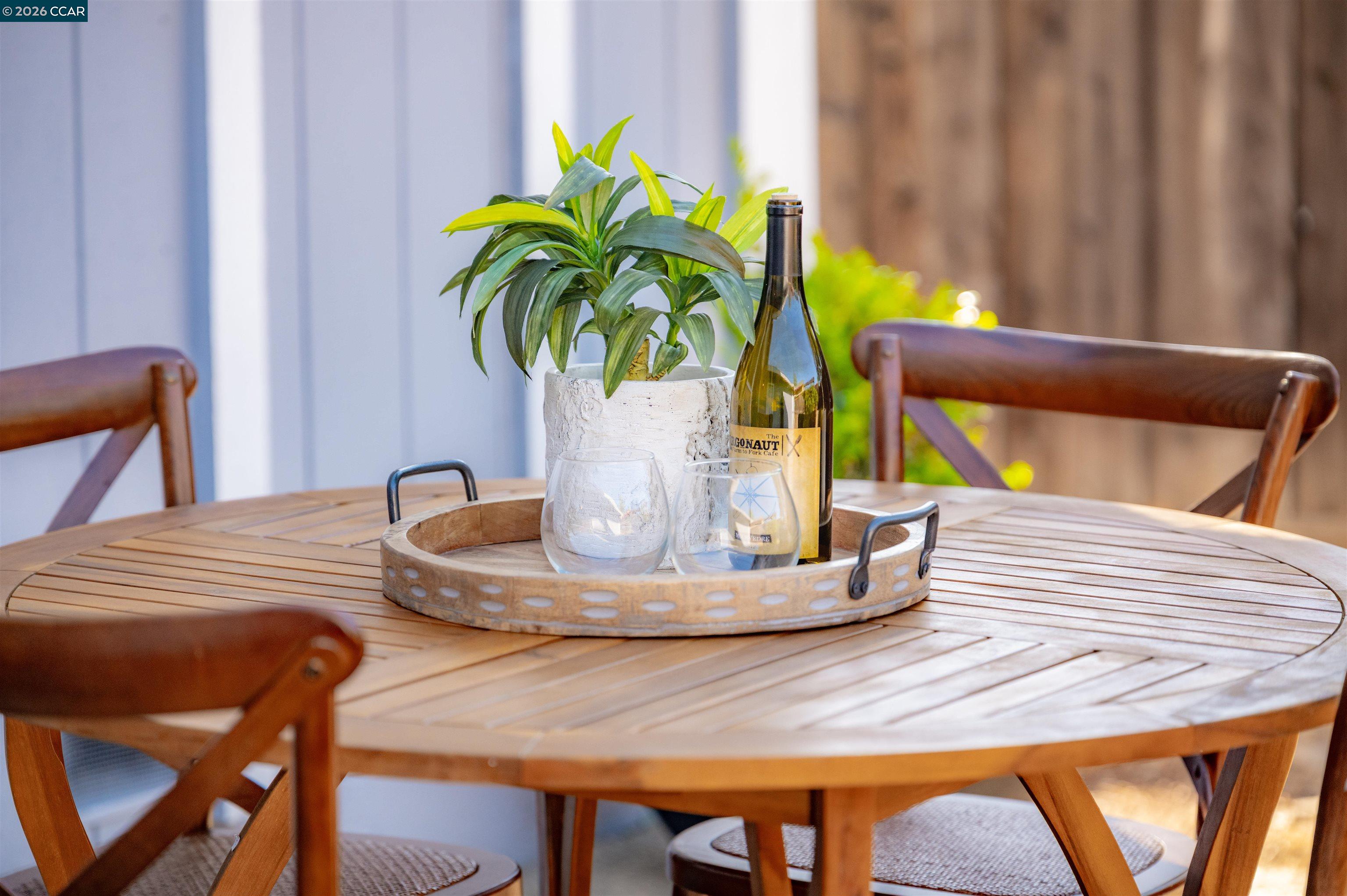 5581 Gonzalez Court Concord, CA 94521 - Photo 40 of 43 a vase of flowers sitting on a dining table