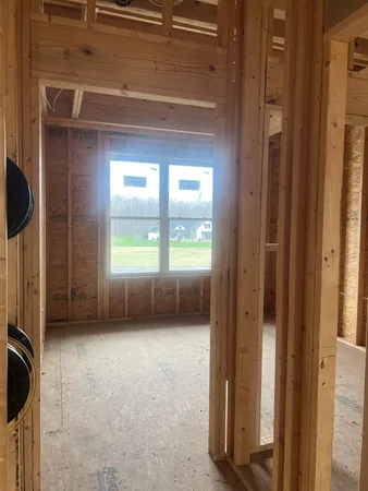 a view of an empty room with a window