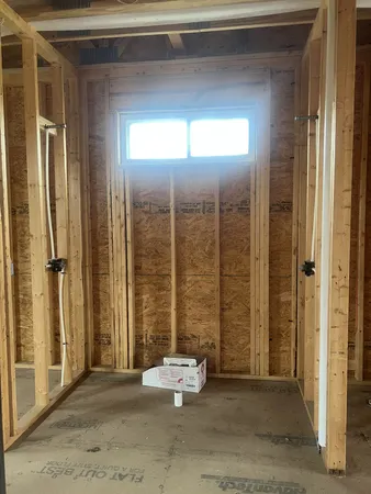 a view of a room with a large window and couch