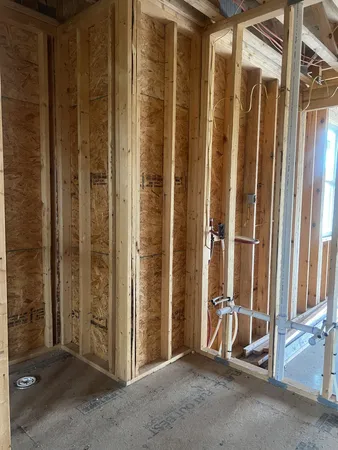 a view of a room with wooden floor and windows