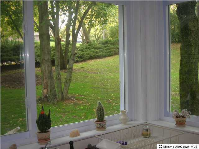 17 Hillside Road Manalapan, NJ 07726 - Photo 3 of 3 a front view of a house with a yard