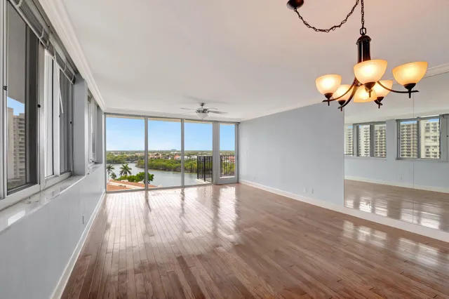 a view of a balcony with yard
