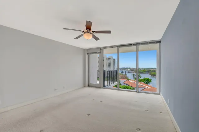 a bathroom with a toilet and a shower curtain