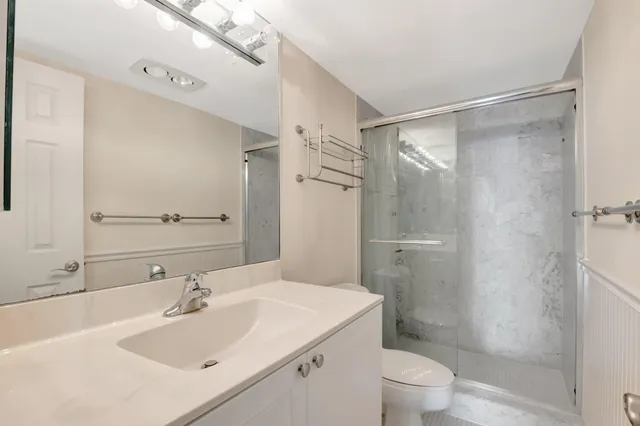 a view of an empty room with a floor to ceiling window and an empty room