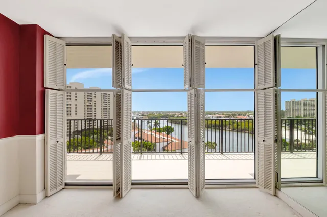 an aerial view of a house with a yard and outdoor seating