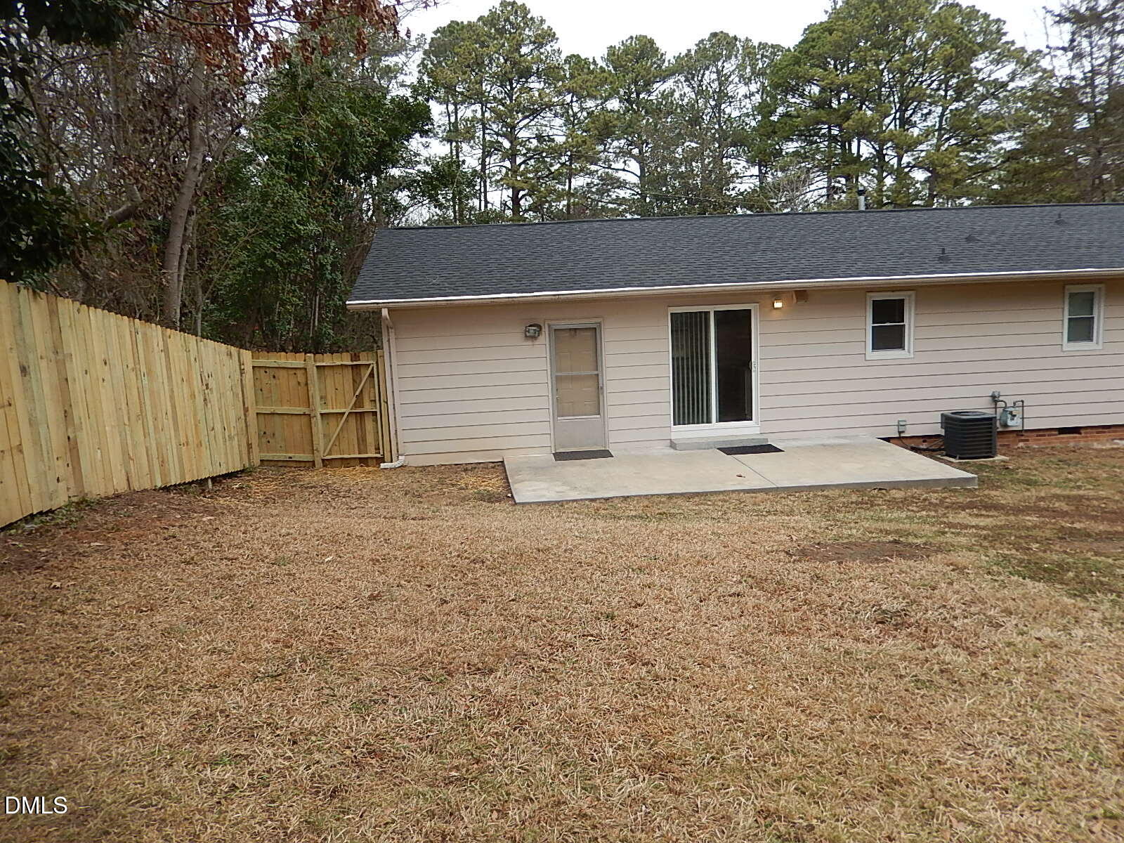 1016 Caspan Street Raleigh, NC 27610 - Photo 24 of 27 a backyard of a house with garage