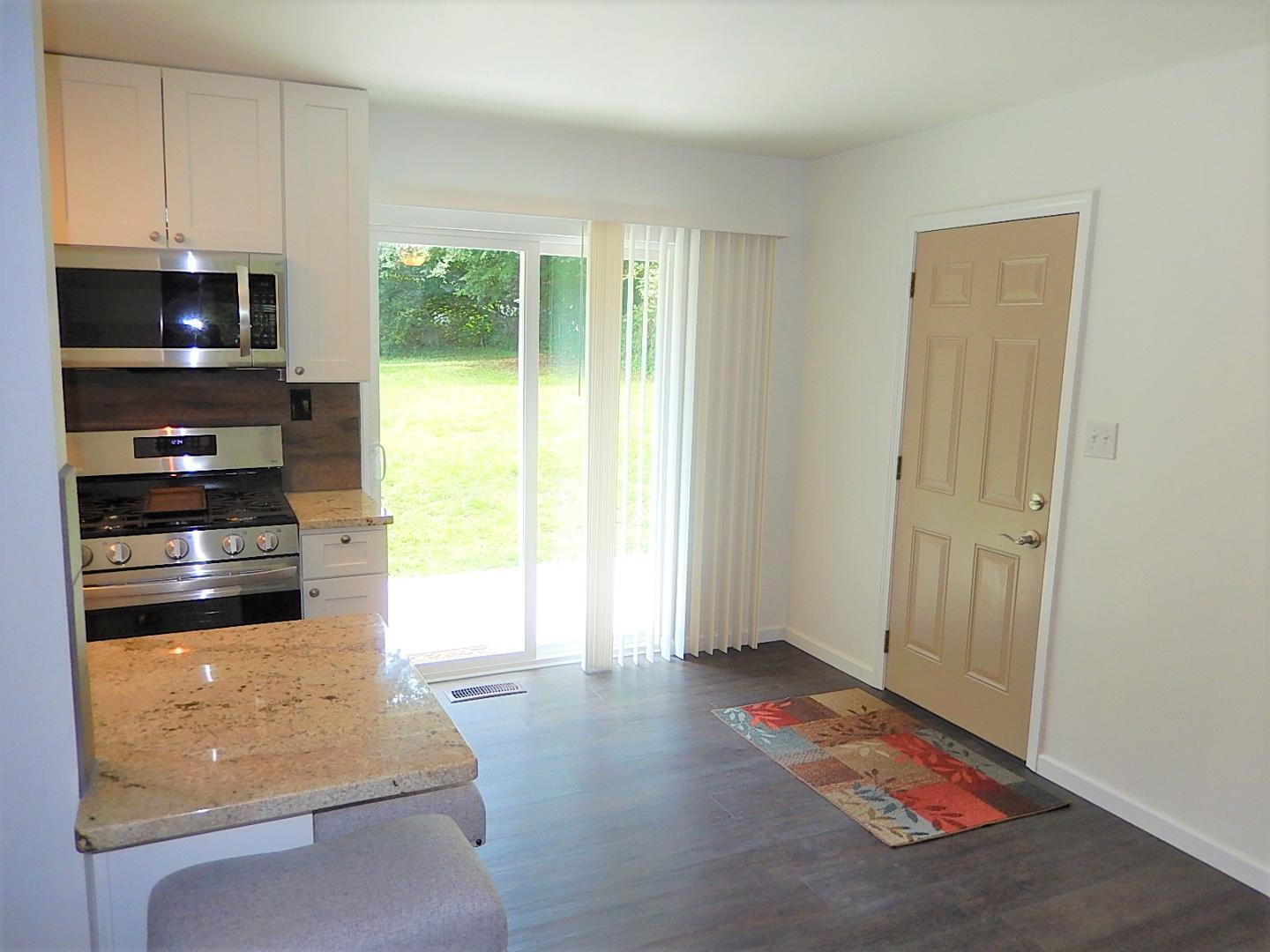 1016 Caspan Street Raleigh, NC 27610 - Photo 4 of 27 a room with window and a flat screen tv