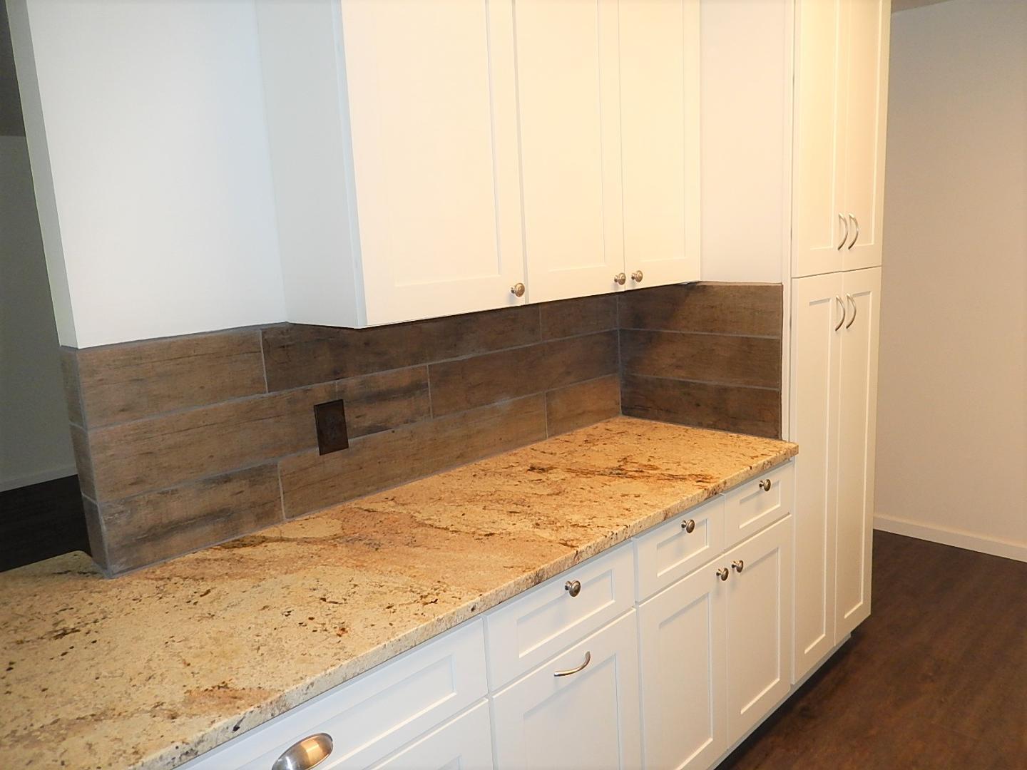 1016 Caspan Street Raleigh, NC 27610 - Photo 5 of 27 a bathroom with a sink and vanity