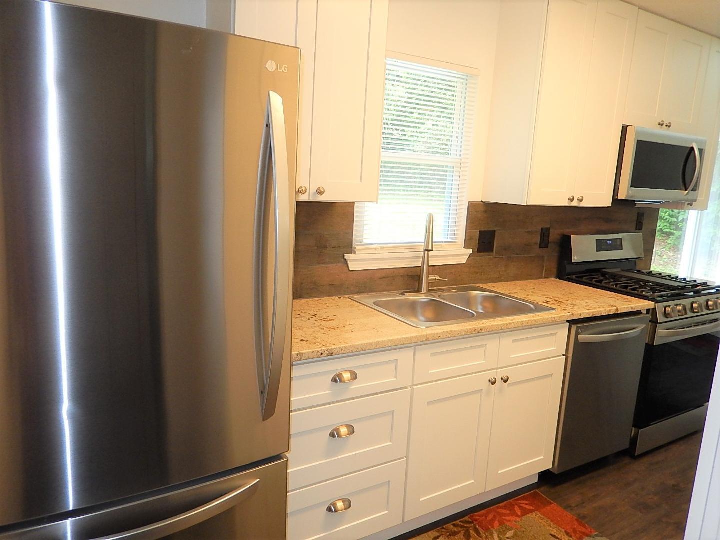 1016 Caspan Street Raleigh, NC 27610 - Photo 6 of 27 a room with storage and utility