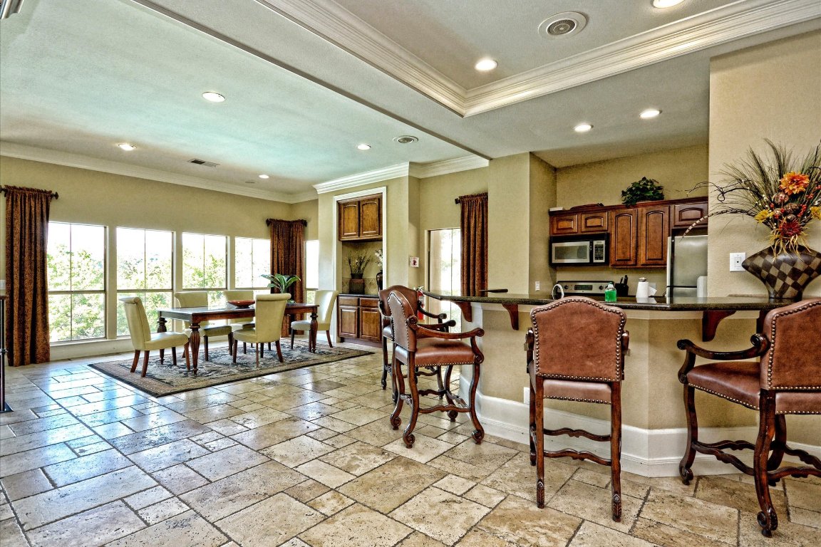 6000 Shepherd Mountain Cove, Unit 1805 Austin, TX 78730 - Photo 15 of 20 a room with lots of chairs and view of living room