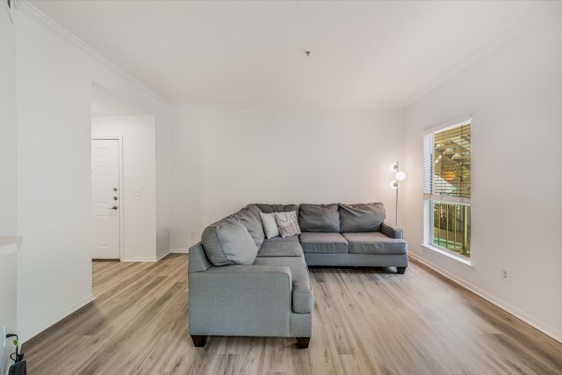 6000 Shepherd Mountain Cove, Unit 1805 Austin, TX 78730 - Photo 2 of 20 a living room with furniture and a wooden floor