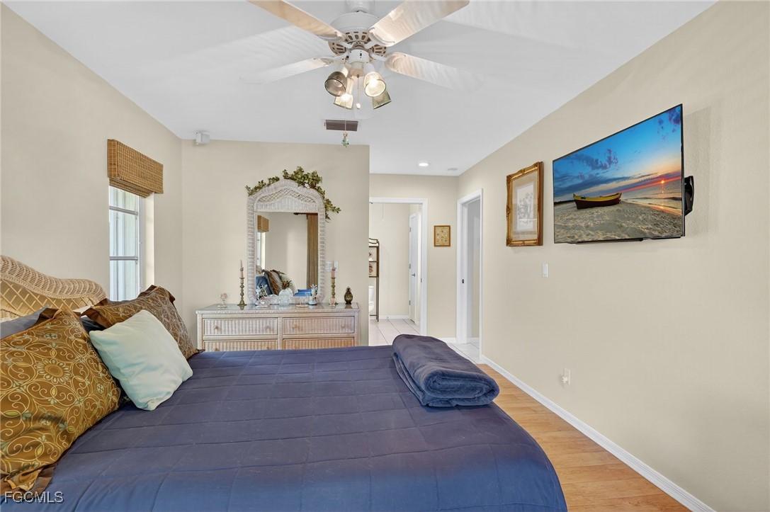4306 Southwest 3rd Avenue Cape Coral, FL 33914 - Photo 23 of 50 a living room with furniture and a chandelier