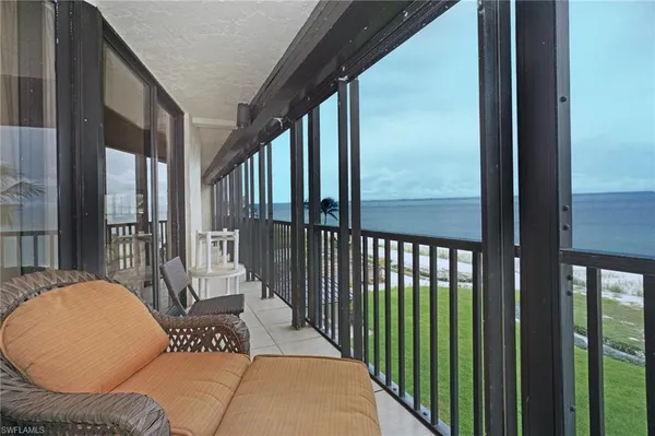 a view of balcony with furniture
