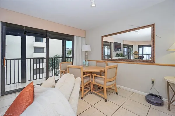 a kitchen with granite countertop white cabinets and stainless steel appliances
