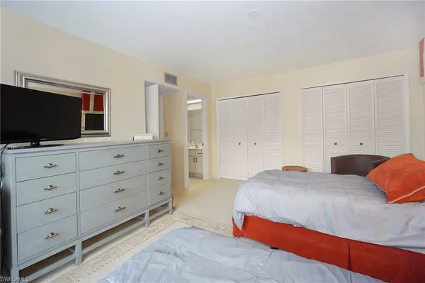 a living room with furniture and large window