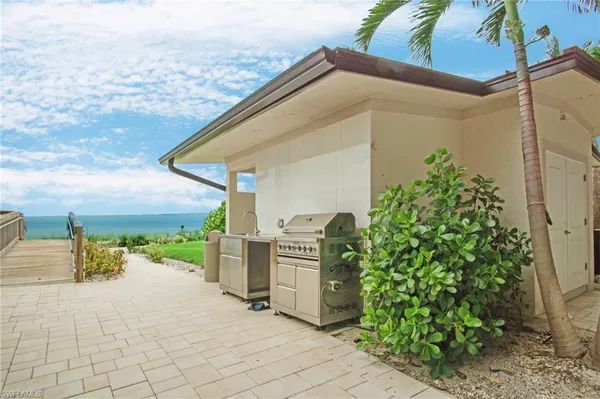 a view of swimming pool with outdoor seating