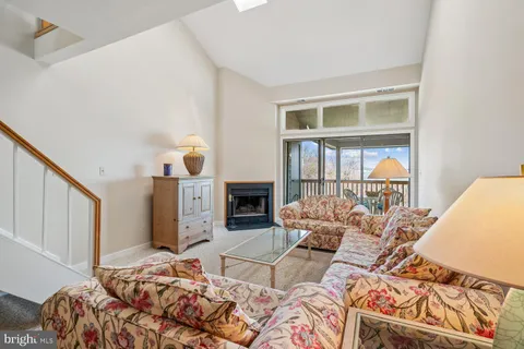 a living room with a couch and a fireplace