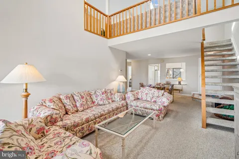 a bedroom with furniture and a wooden floor