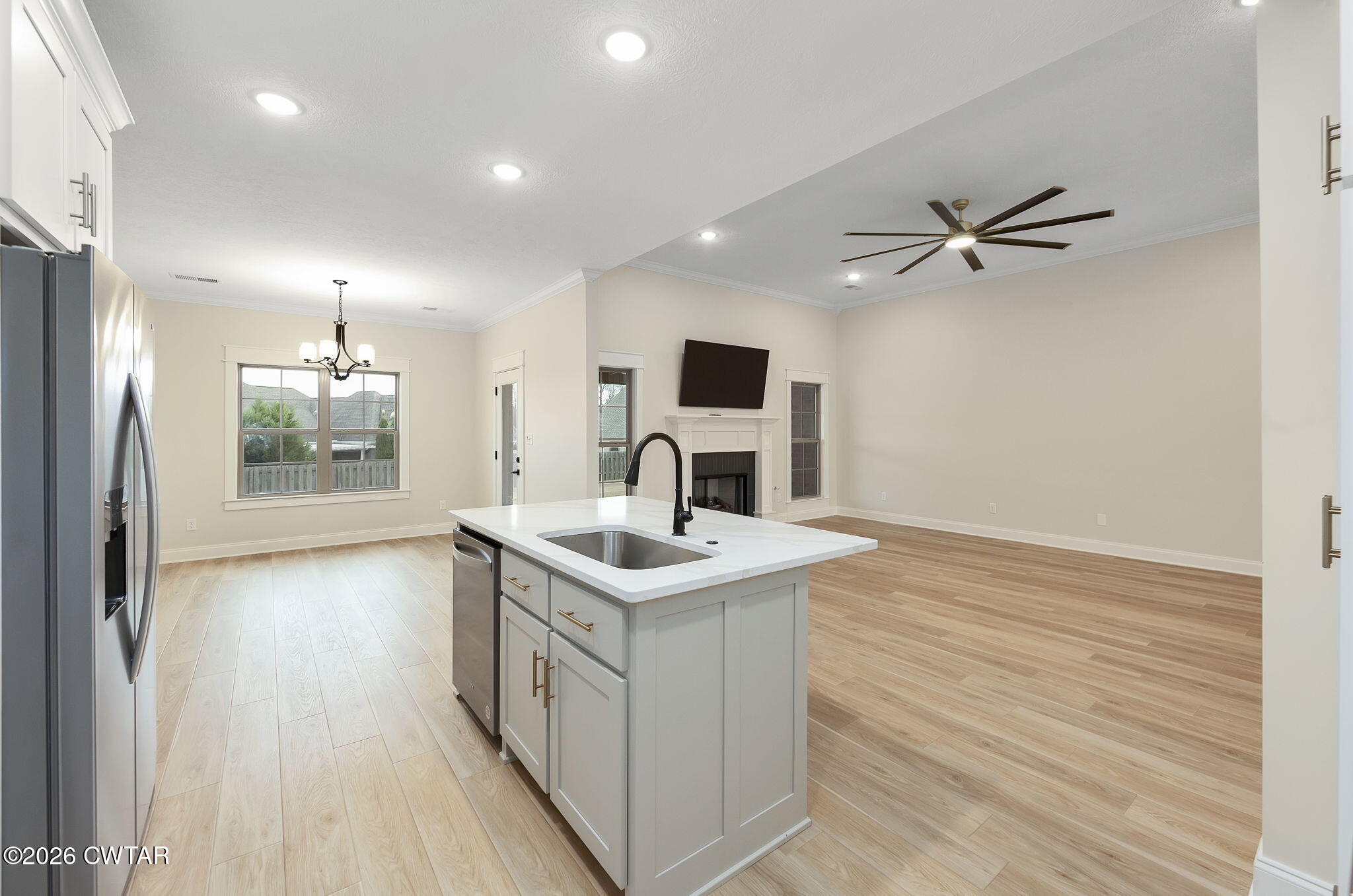 126 Isaiah Drive Jackson, TN 38305 - Photo 13 of 32 a kitchen with a sink and a refrigerator