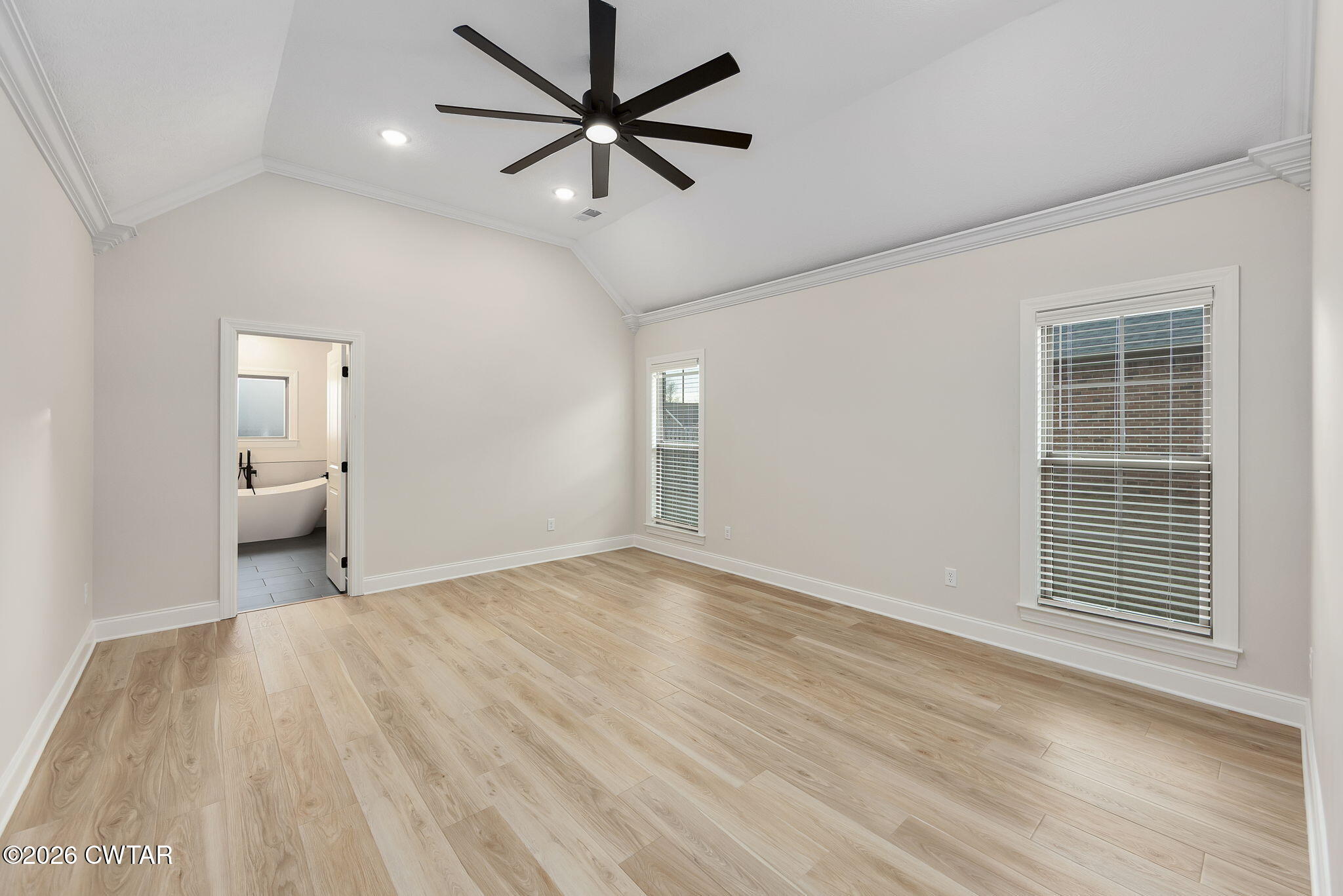 126 Isaiah Drive Jackson, TN 38305 - Photo 15 of 32 wooden floor in an empty room with a window