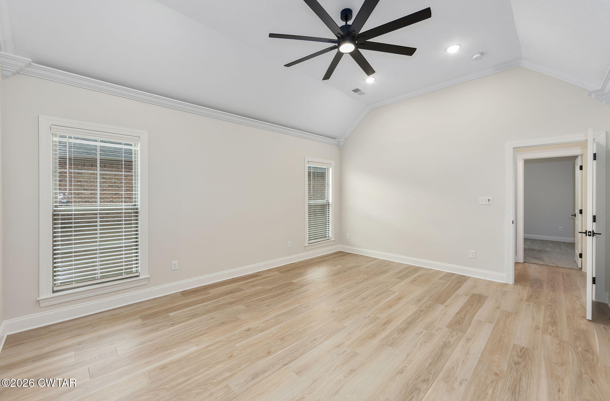 126 Isaiah Drive Jackson, TN 38305 - Photo 16 of 32 wooden floor in an empty room with a window