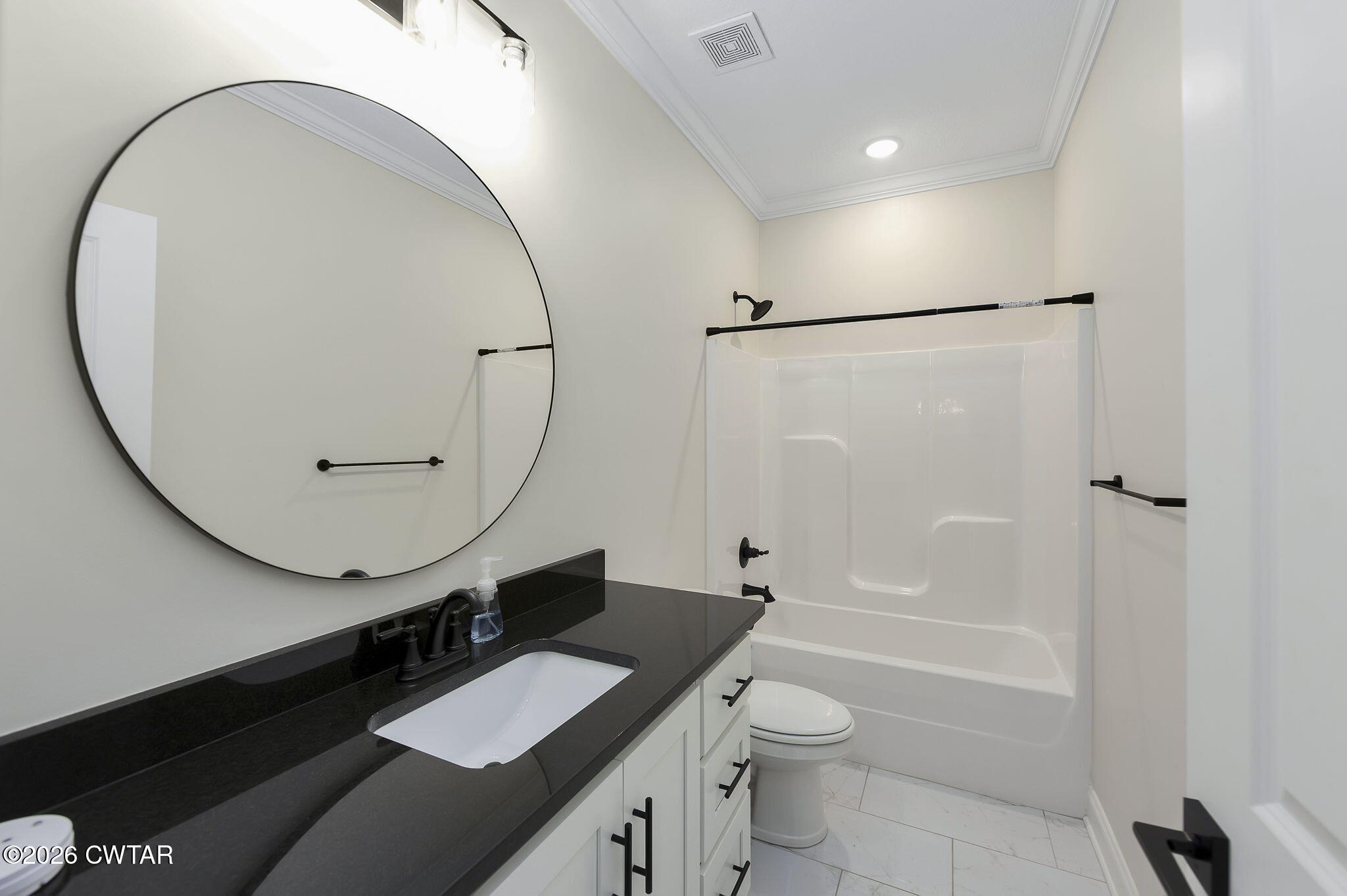 126 Isaiah Drive Jackson, TN 38305 - Photo 22 of 32 a bathroom with a granite countertop sink toilet a shower and a mirror