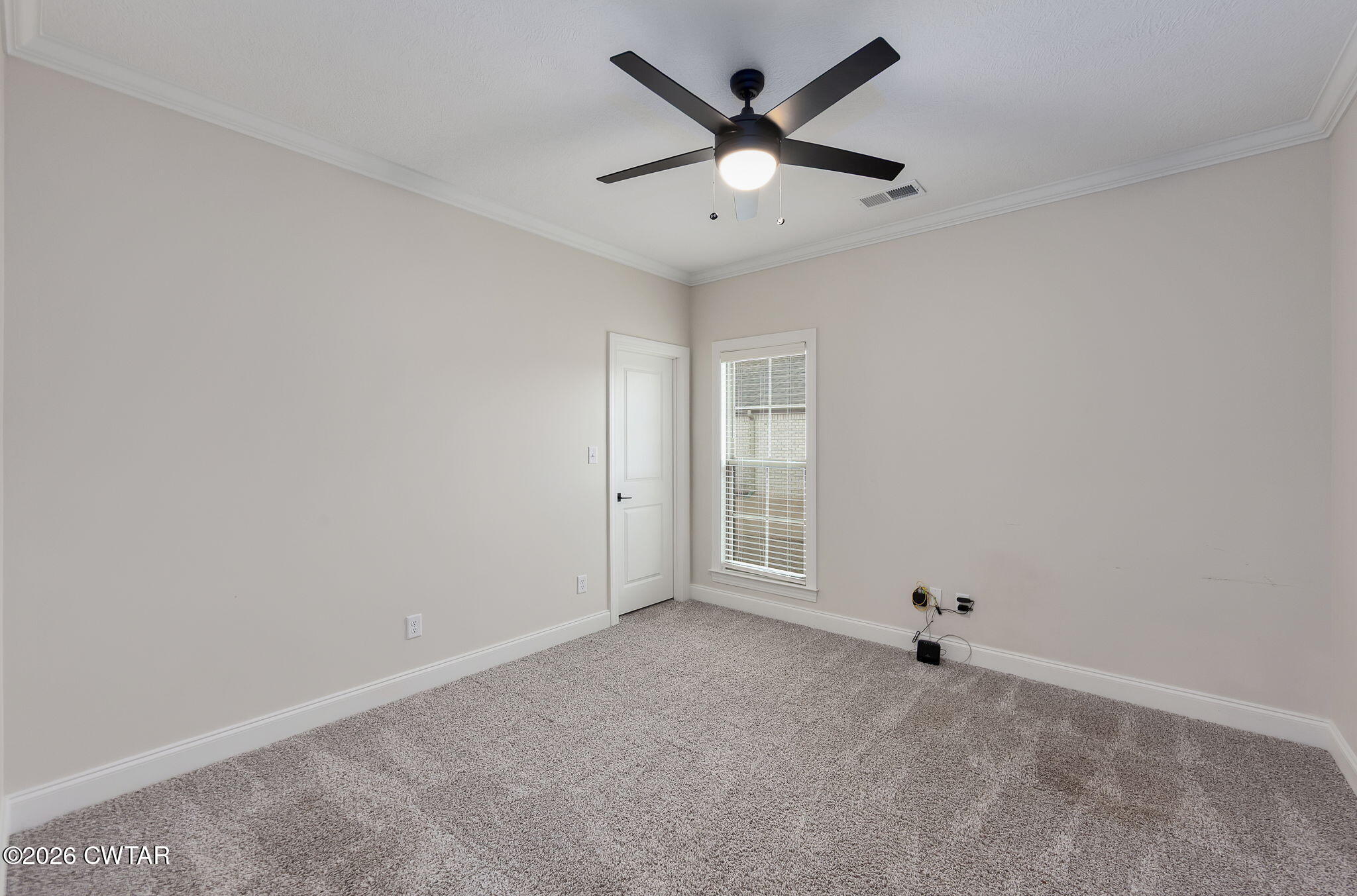 126 Isaiah Drive Jackson, TN 38305 - Photo 23 of 32 an empty room with ceiling fan and windows