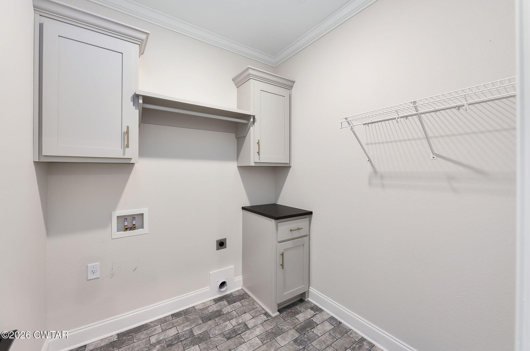 126 Isaiah Drive Jackson, TN 38305 - Photo 27 of 32 a view of storage and utility room with washer and dryer