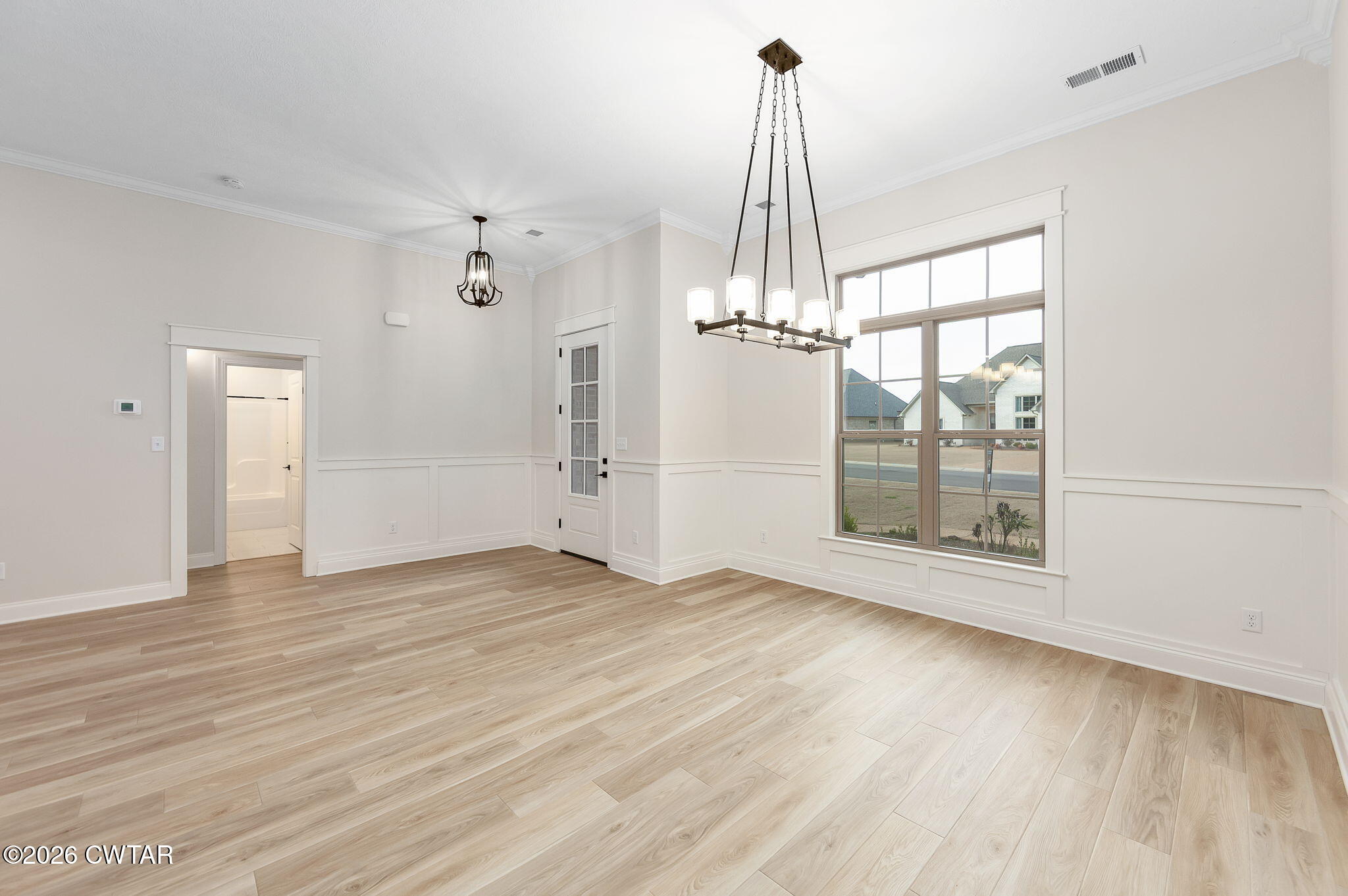 126 Isaiah Drive Jackson, TN 38305 - Photo 5 of 32 a view of empty room with wooden floor and fan
