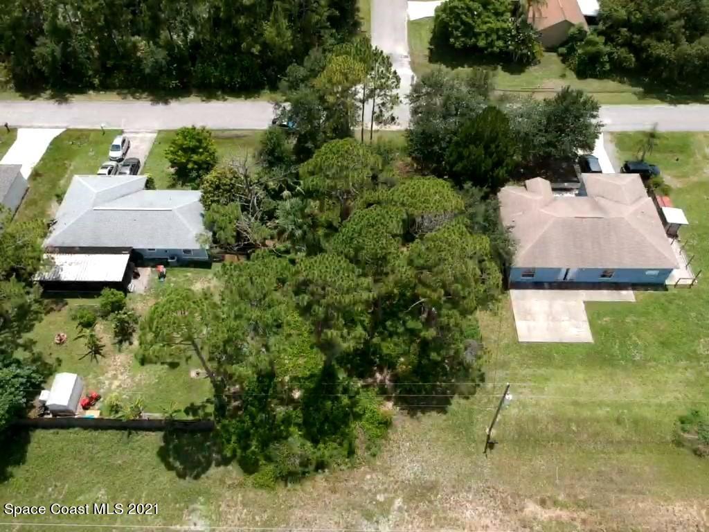 559 Town Road Southwest Palm Bay, FL 32908 - Photo 2 of 4 an aerial view of a house with a yard and lake view