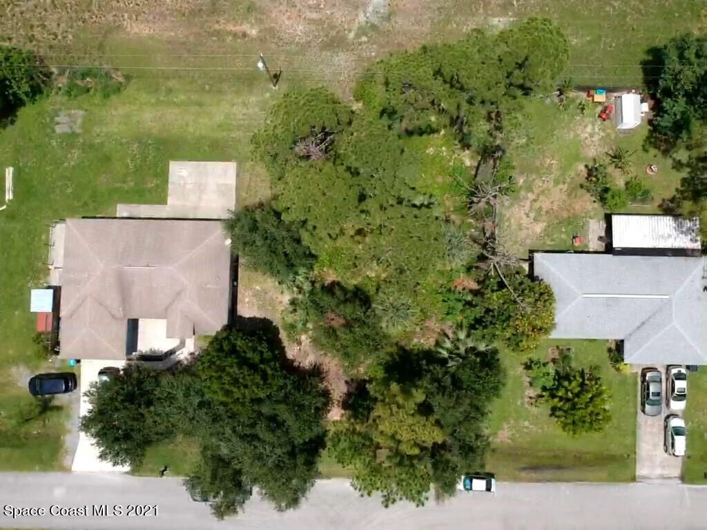 559 Town Road Southwest Palm Bay, FL 32908 - Photo 3 of 4 an aerial view of a house with a yard
