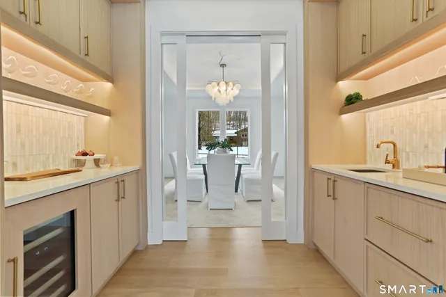 a sink with white cabinets