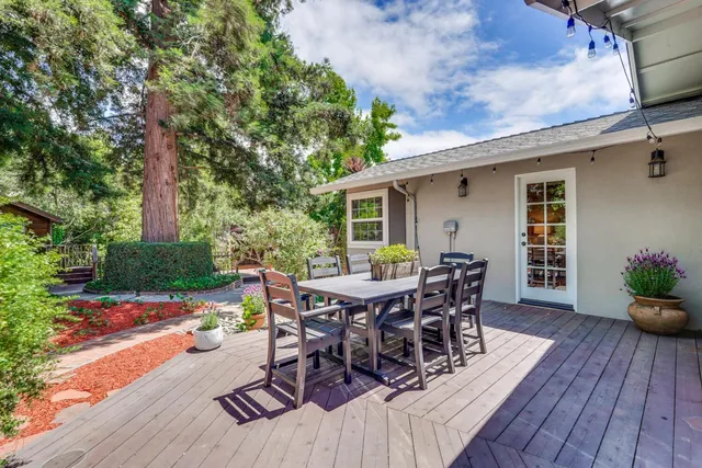 a view of a house with patio and wooden floor