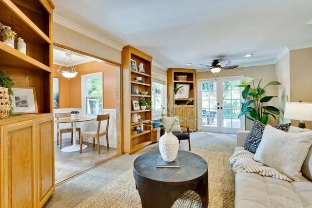 a living room with furniture and a table